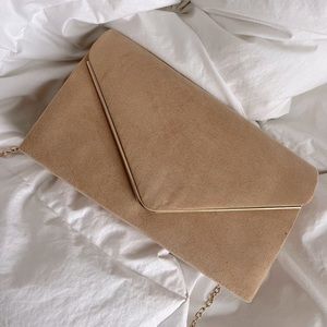 Nude and gold clutch with chain shoulder strap